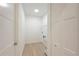 A view of the laundry room with a sink and storage shelving at 4661 Forlano Cir, North Port, FL 34291