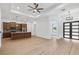 Open living space featuring modern kitchen, recessed lighting, plank flooring and stylish front door at 4661 Forlano Cir, North Port, FL 34291