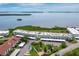 Aerial view of condos overlooking bay showcases property's waterfront location and lush landscaping at 4745 Independence Dr # 4745, Bradenton, FL 34210