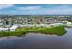 Aerial view of waterfront complex showcases prime location with stunning views and lush landscaping at 4745 Independence Dr # 4745, Bradenton, FL 34210