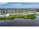 Beautiful aerial view of a waterfront condo community with lush green landscaping and tranquil water features at 4745 Independence Dr # 4745, Bradenton, FL 34210