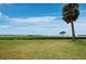 Enjoy the serene backyard with lush green lawn and beautiful water views at 4745 Independence Dr # 4745, Bradenton, FL 34210
