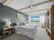 Spacious primary bedroom with water view and ceiling fan at 4745 Independence Dr # 4745, Bradenton, FL 34210