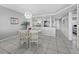 Bright dining area featuring a glass table with views to the kitchen at 4745 Independence Dr # 4745, Bradenton, FL 34210