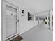 Exterior view of white condo building with a white front door and black shutters at 4745 Independence Dr # 4745, Bradenton, FL 34210