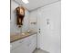 A welcoming foyer features a granite-topped console with storage and a charming decorative seashell at 4745 Independence Dr # 4745, Bradenton, FL 34210