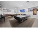 Recreation room with carpet flooring, pool tables, and comfortable seating at 4745 Independence Dr # 4745, Bradenton, FL 34210