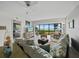 Relaxing living area with comfy seating and amazing waterfront views through large windows at 4745 Independence Dr # 4745, Bradenton, FL 34210