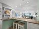 Beautifully decorated living room and bar featuring a view of the ocean at 4745 Independence Dr # 4745, Bradenton, FL 34210