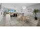 Open living space with tile flooring, waterfront views, and dining area with seating for four at 4745 Independence Dr # 4745, Bradenton, FL 34210