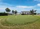 A manicured putting green offers golf enthusiasts a convenient place to practice at 4745 Independence Dr # 4745, Bradenton, FL 34210