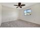 Bedroom featuring carpet flooring, a ceiling fan, and a bright window at 5004 32Nd E St, Bradenton, FL 34203