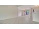 Open dining room with tile flooring, large window, and chandelier at 5004 32Nd E St, Bradenton, FL 34203
