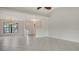 Bright, open-concept living room with tile floors, large window, and easy access to the front entrance at 5004 32Nd E St, Bradenton, FL 34203