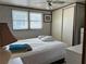 Sunlit bedroom with a clean, minimalist style, featuring a double bed and ample storage at 5268 Boca Raton Ave, Sarasota, FL 34234