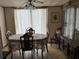 Inviting dining room with a floral tablecloth and traditional decor at 5268 Boca Raton Ave, Sarasota, FL 34234
