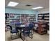 Community library with reading area and rows of bookshelves at 5268 Boca Raton Ave, Sarasota, FL 34234
