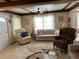 Cozy living room featuring an area rug, neutral colored walls, and comfortable seating at 5268 Boca Raton Ave, Sarasota, FL 34234