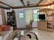 Bright living room with ceiling fan, neutral decor, and plenty of natural light at 5268 Boca Raton Ave, Sarasota, FL 34234