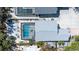 Aerial view of a screened pool area, showing outdoor seating and palm trees at 5385 Avenida Del Mare, Sarasota, FL 34242