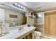 Bathroom featuring a large mirror, shower, and classic design at 5385 Avenida Del Mare, Sarasota, FL 34242
