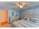 Bedroom featuring a bed with accent pillows, wall art, and a dresser at 5385 Avenida Del Mare, Sarasota, FL 34242