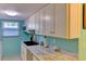 A well-equipped kitchen featuring modern appliances, granite countertops, and plenty of cabinet space at 5385 Avenida Del Mare, Sarasota, FL 34242