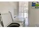 Laundry room featuring a washing machine and dryer with a window at 5385 Avenida Del Mare, Sarasota, FL 34242