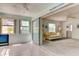 Bright living room with sliding doors leading to an enclosed patio area at 5385 Avenida Del Mare, Sarasota, FL 34242