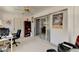 Office space featuring a sliding glass door, chair, and bookcase at 5385 Avenida Del Mare, Sarasota, FL 34242