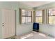 Enclosed sunroom area with tile flooring and an exterior door at 5385 Avenida Del Mare, Sarasota, FL 34242