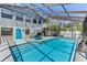 Enjoy the refreshing pool with enclosed lanai, connected to the home's second story, and exterior stair access at 5385 Avenida Del Mare, Sarasota, FL 34242