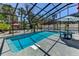 Beautiful backyard pool features a screened-in lanai with plenty of seating at 5385 Avenida Del Mare, Sarasota, FL 34242