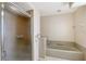 Bathroom boasts a glass shower, tub and tile flooring at 6096 Wilshire Blvd # 9, Sarasota, FL 34238