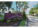 Lakeshore Village community sign with manicured landscaping at 6096 Wilshire Blvd # 9, Sarasota, FL 34238