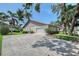 Exterior shot featuring a well manicured yard at 6096 Wilshire Blvd # 9, Sarasota, FL 34238