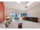 Bright living room with high ceilings, carpet flooring and a view of the water at 6096 Wilshire Blvd # 9, Sarasota, FL 34238