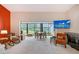 Cozy living room featuring water views, bright light and patio access at 6096 Wilshire Blvd # 9, Sarasota, FL 34238