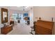 Bright living room with carpet flooring, skylights, ceiling fan, and a view of the water at 6096 Wilshire Blvd # 9, Sarasota, FL 34238