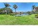 Lush green space with a pond at 6096 Wilshire Blvd # 9, Sarasota, FL 34238