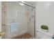 Bathroom with a glass shower, a sleek toilet, and neutral tile finishes at 6204 Midnight Pass Rd # 201, Sarasota, FL 34242