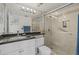 Modern bathroom features a tiled shower with glass doors and a sleek vanity at 6204 Midnight Pass Rd # 201, Sarasota, FL 34242