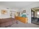Bedroom features a large dresser, an ensuite bathroom, and a patio access at 6204 Midnight Pass Rd # 201, Sarasota, FL 34242