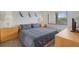 Comfortable bedroom with a queen bed and matching nightstands provides a serene retreat at 6204 Midnight Pass Rd # 201, Sarasota, FL 34242
