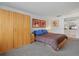 Bedroom featuring two beds, large closet, and ensuite bath at 6204 Midnight Pass Rd # 201, Sarasota, FL 34242