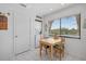 Breakfast nook with a laundry area offers a cozy space by a window at 6204 Midnight Pass Rd # 201, Sarasota, FL 34242