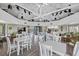 Light-filled clubhouse with vaulted ceilings, numerous tables, and a serving area at 6204 Midnight Pass Rd # 201, Sarasota, FL 34242