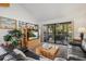 Cozy living room with a view to the balcony, comfortable seating, and stylish decor at 6204 Midnight Pass Rd # 201, Sarasota, FL 34242