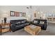 Spacious living room with comfortable seating, decor, and a view into the dining area at 6204 Midnight Pass Rd # 201, Sarasota, FL 34242