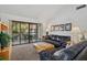 Cozy living room with access to balcony, comfortable seating, and stylish decor at 6204 Midnight Pass Rd # 201, Sarasota, FL 34242